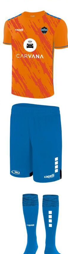 Away kit: orange jersey, blue shorts and blue socks